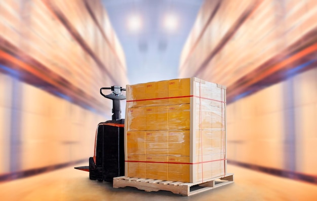 Electric Forklift Pallet Jack with Packaging boxes Stacked in Blurred Warehouse Suppiles Warehouse.