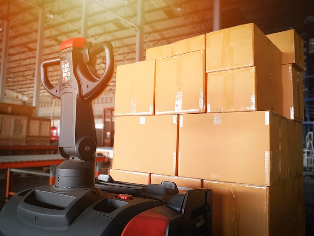 Electric Forklift Pallet Jack with Packaging Boxes Stacked on Pallet Distribution Supplies Warehouse