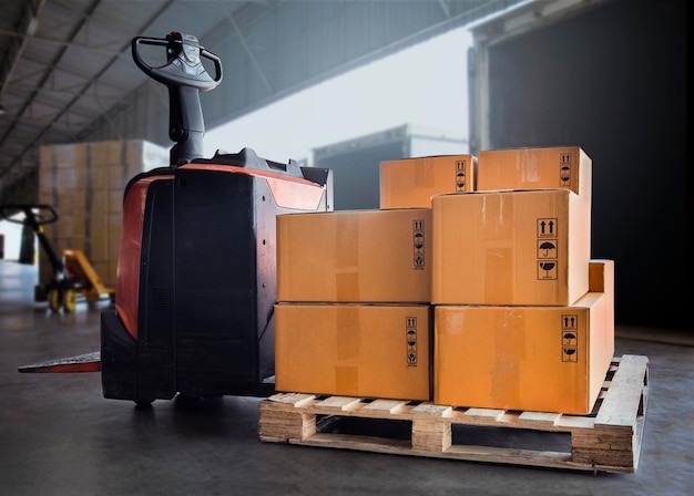 Electric Forklift Pallet Jack with Packaging Boxes Stacked on Pallet Distribution Supplies Warehouse