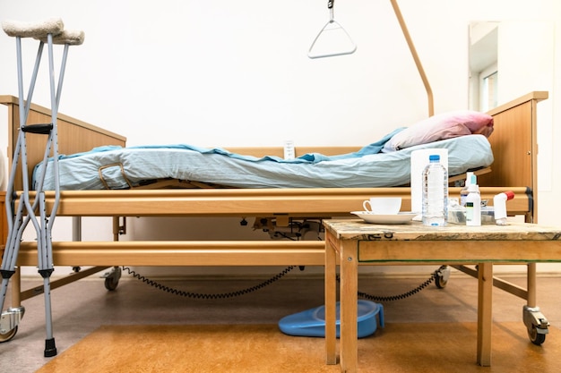 Electric hospital bed crutches and table at home