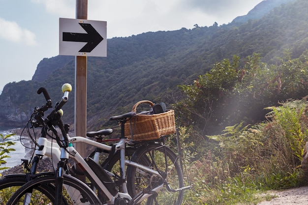 Electric mountain bikes on a road sign on the way to the route.