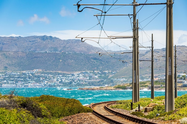 Electric Passenger Railway line on the shoreline of False Bay, Cape Town South Africa