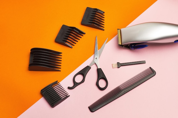 Electric razor and complements on a pink and orange baclground