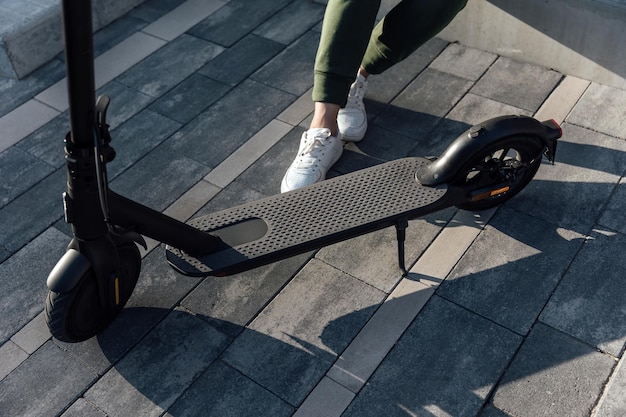 Electric scooter on concrete surface on urban street