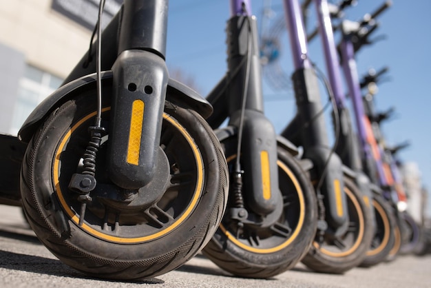 Electric scooters are parked in the city center Modern public mobile transport