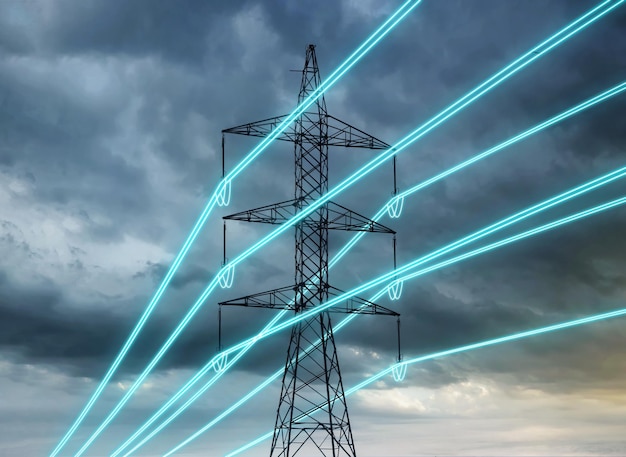 Electric transmission tower with glowing wires against the dark rainy sky Energy concept