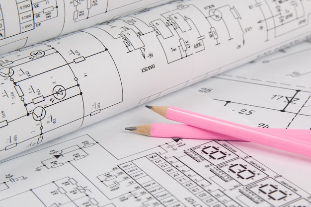 Electrical engineering drawings and pencils.