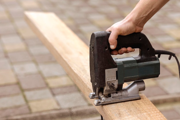 Electrical Jigsaw Equipment for Woodwork. Cutting Boards with Electric Jigsaw.