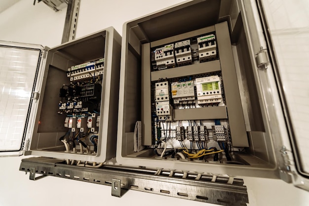 Electrical panel at a assembly line factory Controls and switches Color wires in a box of distribution of an electricity