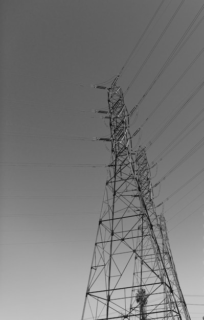 Electrical power lines pylon producing energy voltage transmission on electric tower