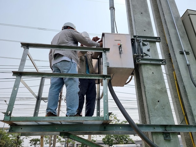 The electrical technician opens the 115kV Load Break Switch control cubicle for operation