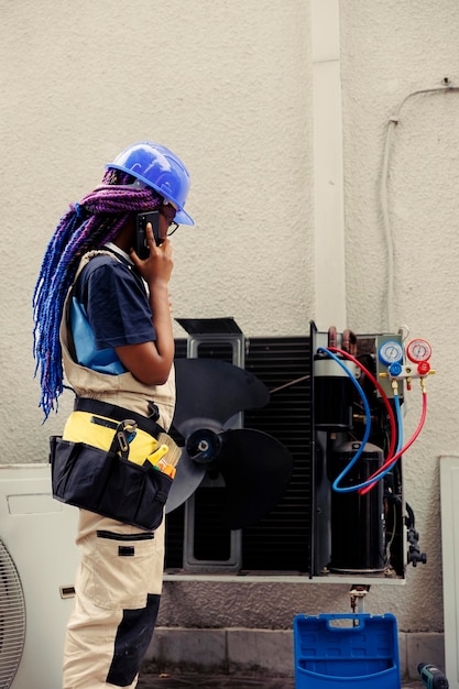 Electrician on the phone with customer