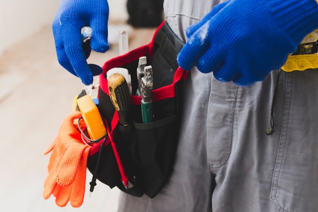 Electrician with tools on belt