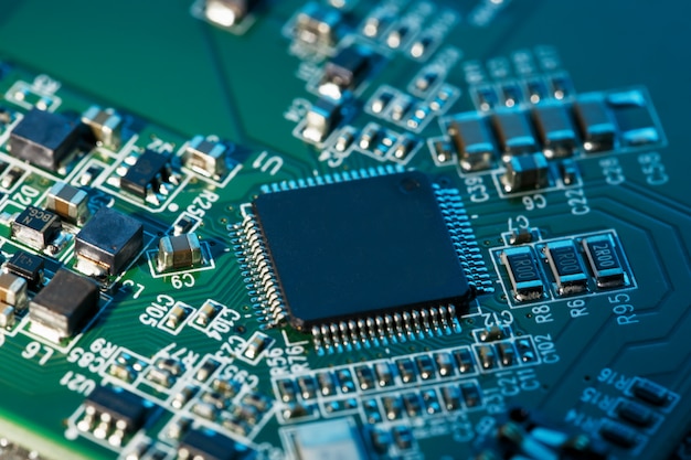 Electronic circuit board close up, processor, chips and capacitors.