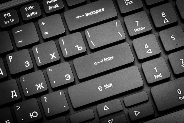 Electronic collection closeup laptop keyboard with russian letter The focus on the Enter key