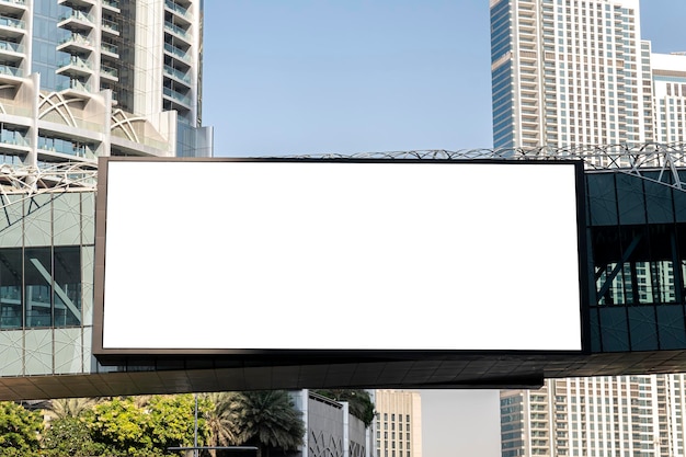 Electronic scoreboard with an empty white screen on a city street Copy space Advertising on the road