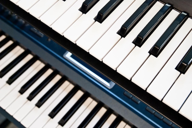 Electronic synthesizer with keyboard and knobs closeup