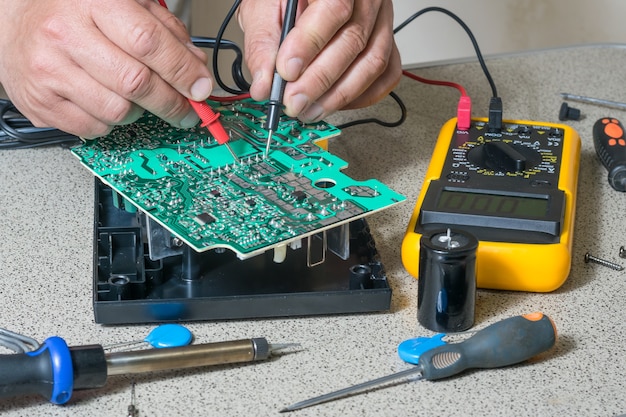 Electronics repair and metering parameters. Broken electronic board, professional repairman