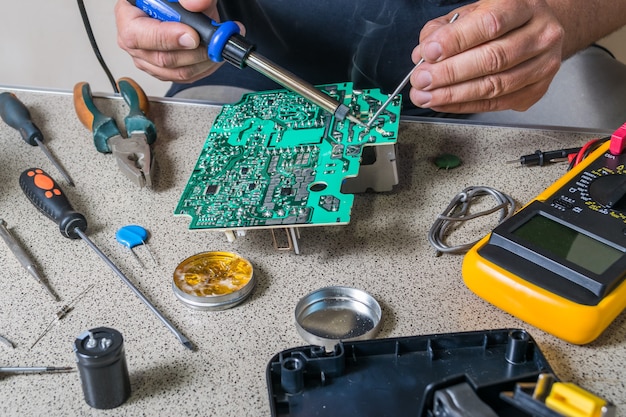 Electronics repair and metering parameters. Broken electronic board, professional repairman