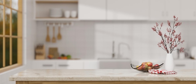 Elegance marble kitchen tabletop with decors and copy space over blurred kitchen background