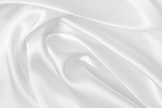 Elegance white satin silk with waves abstract background luxury cloth elegant wallpaper design Abstract background luxury cloth or liquid wave