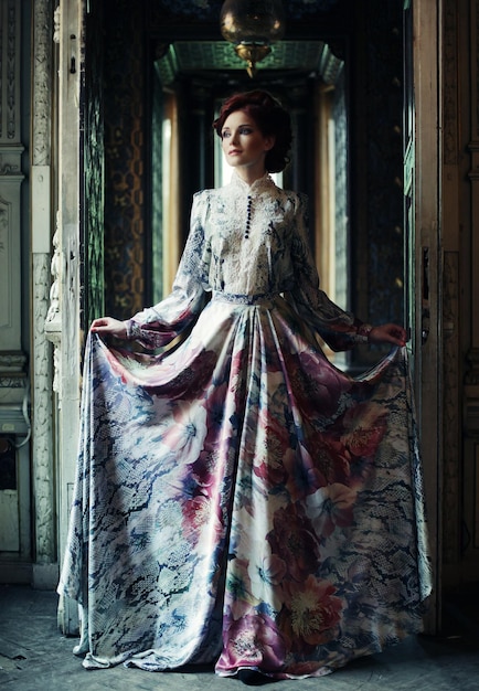 Elegance woman with flying dress in palace room