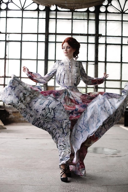 Elegance woman with flying dress in palace room