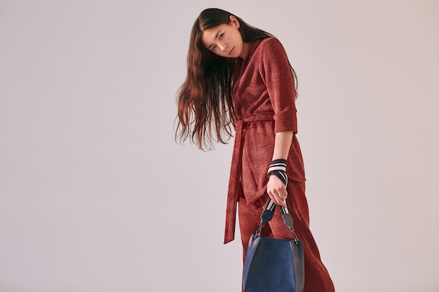 Elegant asian woman in fashionable red suit