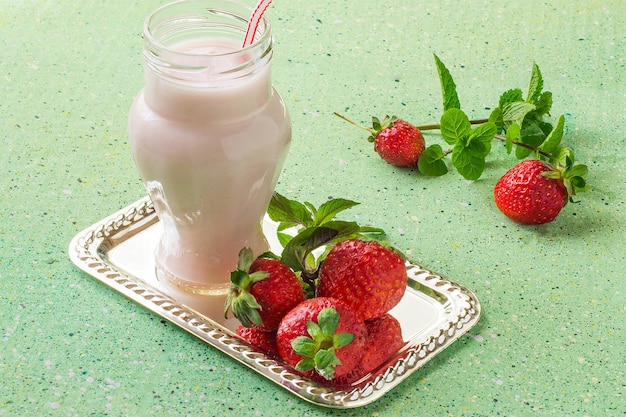 Elegant bank with milkshakes and fresh strawberries