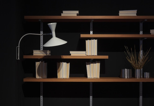 Photo elegant bookshelf for books on black background