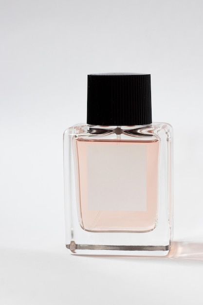 Elegant bottle of women's perfume close-up on an isolated background