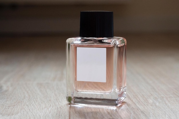 Elegant bottle of women's perfume close-up on an isolated background