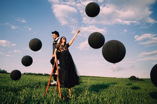 Elegant bride and groom posing together outdoors on a wedding day