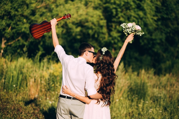 Elegant bride and groom posing together outdoors on a wedding day