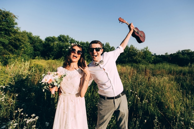 Elegant bride and groom posing together outdoors on a wedding day