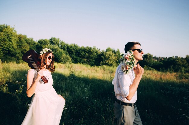 Elegant bride and groom posing together outdoors on a wedding day