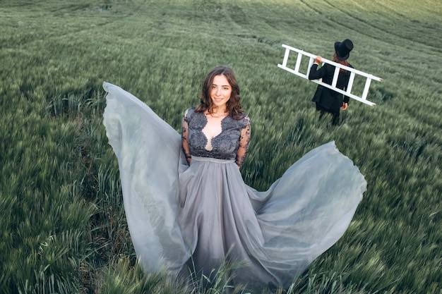 Elegant bride and groom walking and posing on green field