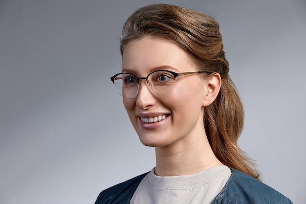 Elegant chic female model in fashion glasses Closeup portrait