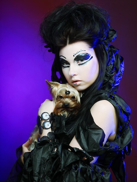 Elegant dark queen with little dog