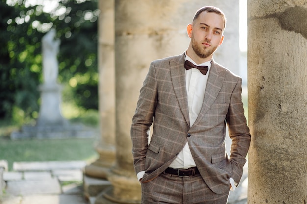 Elegant groom with black bowtie