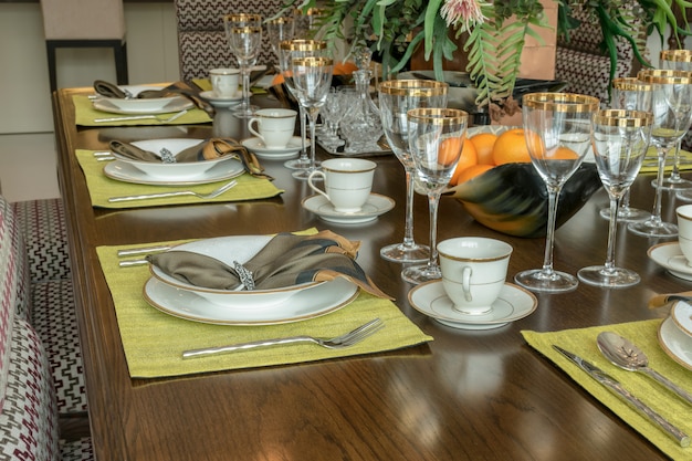 Elegant table set in modern style dining room interior