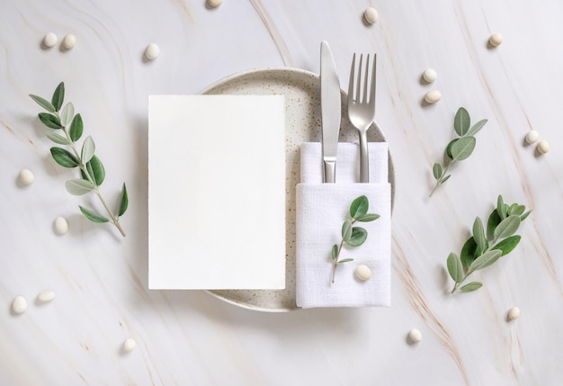 Elegant Table setting with a card decorated with eucalyptus branches top view Wedding mockup