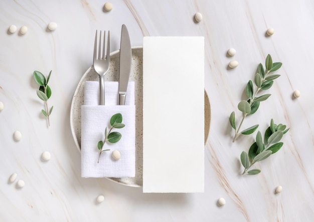 Elegant Table setting with a card decorated with eucalyptus branches top view Wedding mockup