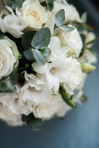 Elegant wedding bouquet of fresh natural flowers and greenery