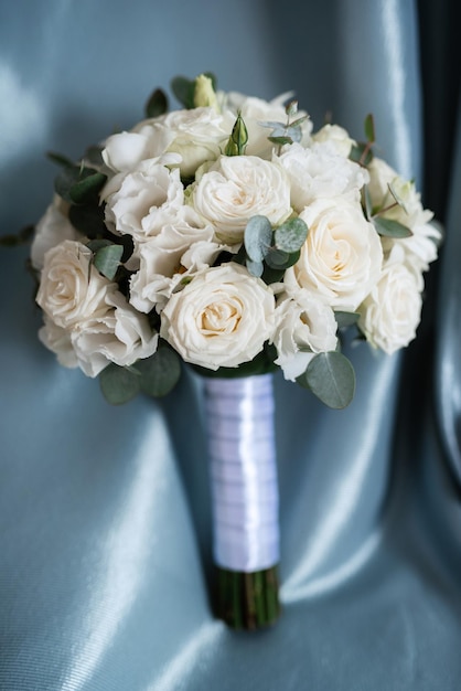 Elegant wedding bouquet of fresh natural flowers and greenery