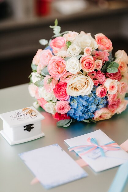 Elegant wedding bouquet of fresh natural flowers and greenery