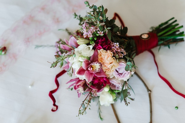 Elegant wedding bouquet of fresh natural flowers and greenery