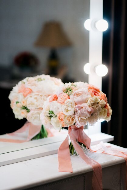 Elegant wedding bouquet of fresh natural flowers and greenery