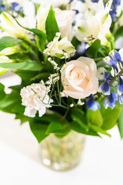 Elegant white rose bouquet adorns a beautiful vase