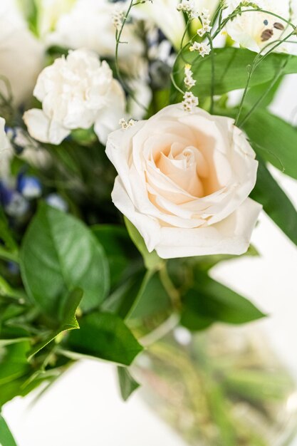 Elegant white rose bouquet adorns a beautiful vase